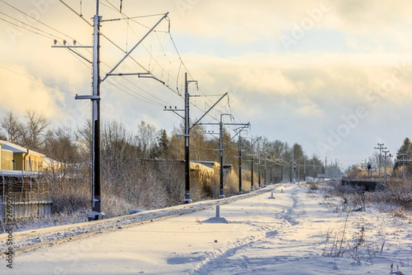Fototapeta Russian railway in winter. Snow railway. Rails and sleepers.
