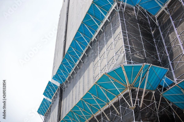 Fototapeta Chiba, Japan, 05/05/2019 , Chiba port tower. construction site with super ordered and clean scaffolding, with extra protection to avoid falling objects..