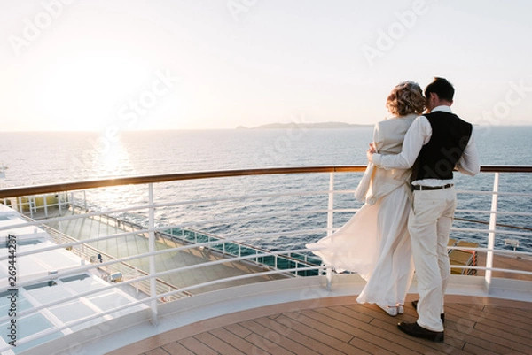 Obraz Young beautiful couple on the deck of a cruise liner in the sea