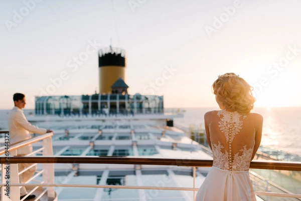 Obraz Young beautiful couple on the deck of a cruise liner in the sea