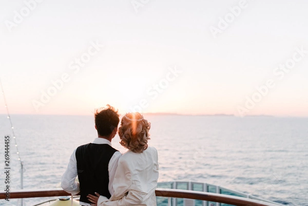 Obraz Young beautiful couple on the deck of a cruise liner in the sea