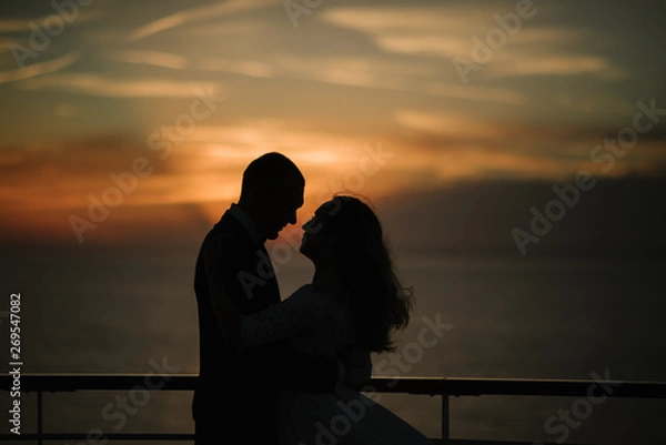 Obraz Young beautiful couple on the deck of a cruise liner in the sea