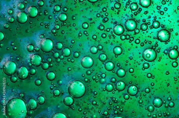 Fototapeta Green transparent slime with air bubbles inside