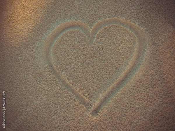 Fototapeta Heart drawing in the sand of the beach