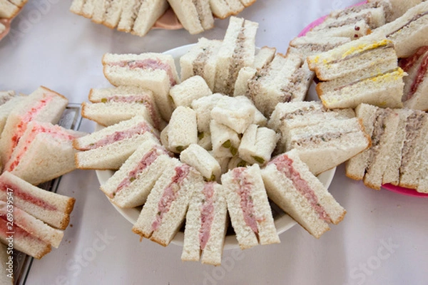 Fototapeta Looking down on triangle finger sandwich plate