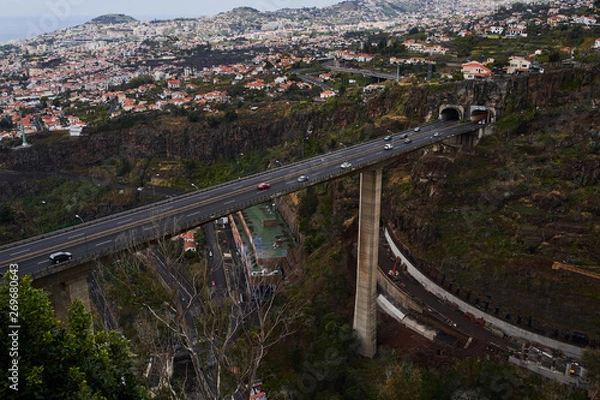 Obraz Big concrete bridge with cars crossing it and city in background, Madeira, Funchal