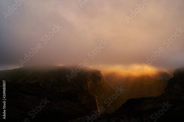 Obraz Mountain at sunset with gold clouds in Madeira,pico de arieiro