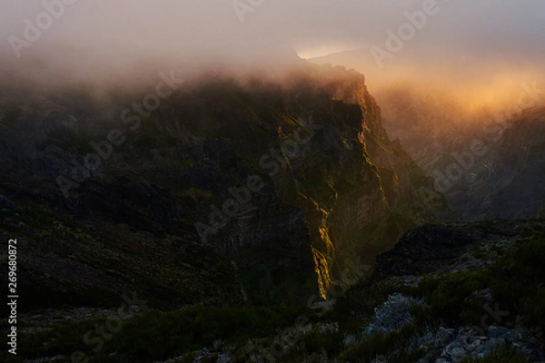 Obraz Mountain at sunset with gold clouds in Madeira,pico de arieiro