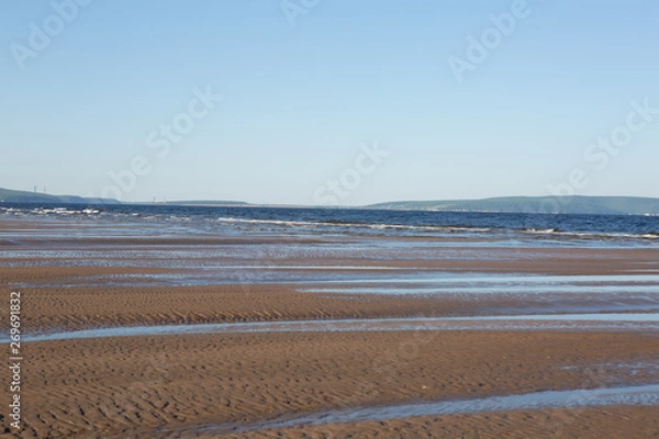 Fototapeta ocean waves lapping on the sandy beach