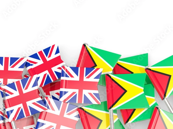 Fototapeta Pins with flags of UK and guyana isolated on white.