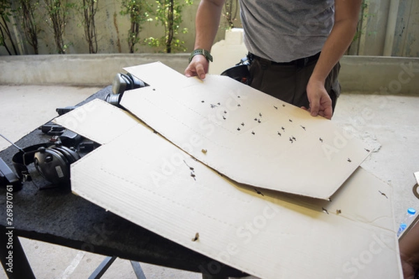 Obraz man cleaning gun