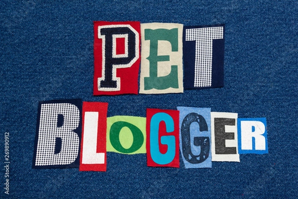 Fototapeta PET BLOGGER text word collage colorful fabric on blue denim, animals and pets blogs and blogging, horizontal aspect