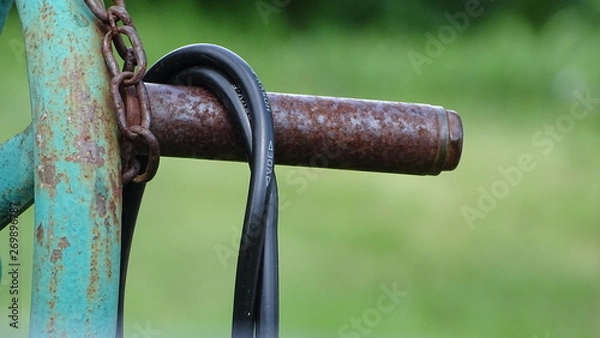 Obraz Rusted bar with cable