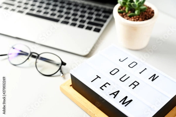 Fototapeta join our team text on lightbox composition on white table background,Business Concept