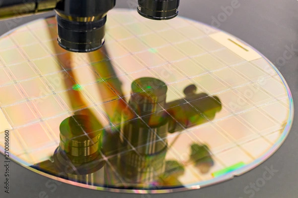Obraz Silicon wafer on machine process examining in microscope.