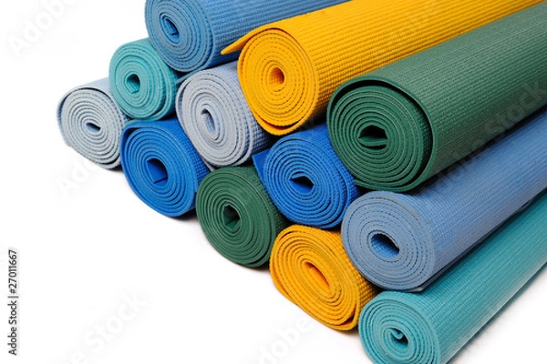 Fototapeta many colorfull yoga mats as a background. isolated on white back