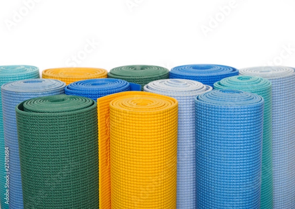 Fototapeta many colorfull yoga mats as a background. isolated on white back