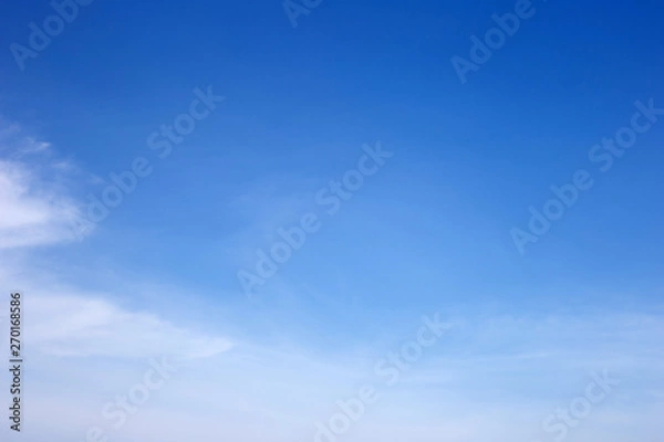 Obraz blue sky with white, soft clouds