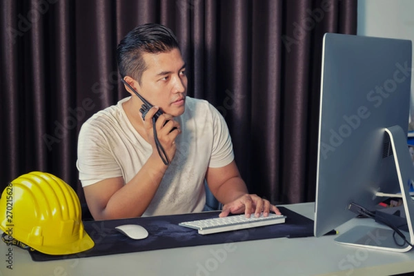 Fototapeta Young Asian engineers are serious and busy