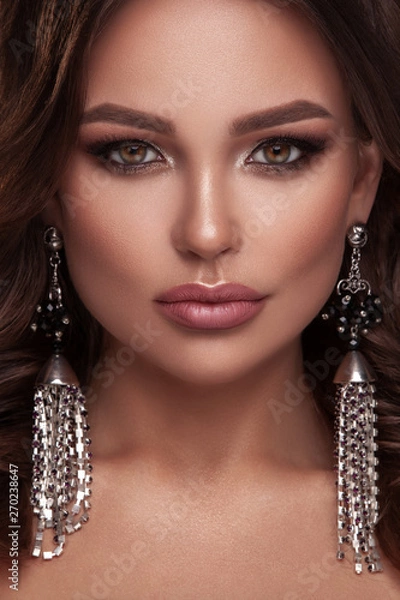 Fototapeta Beauty portrait of model with natural make-up. Fashion shiny highlighter on skin, sexy gloss lips make-up