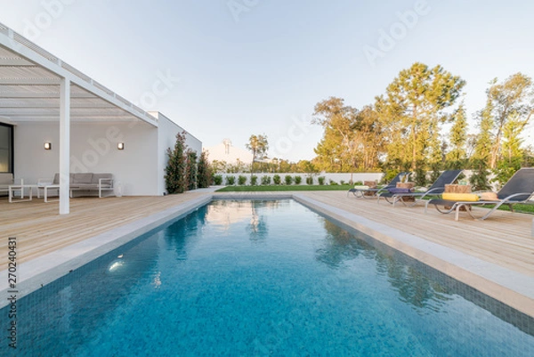 Fototapeta Modern villa with pool and garden