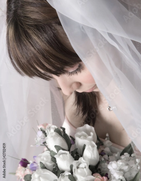 Fototapeta bridal portrait looking down at bouquet