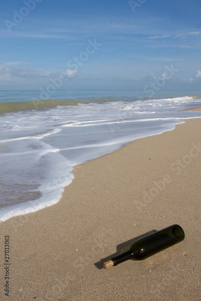 Obraz A bottle on  beach