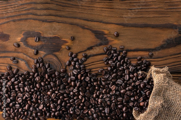 Obraz Cup of coffee and burlap bag on background of coffee beans.