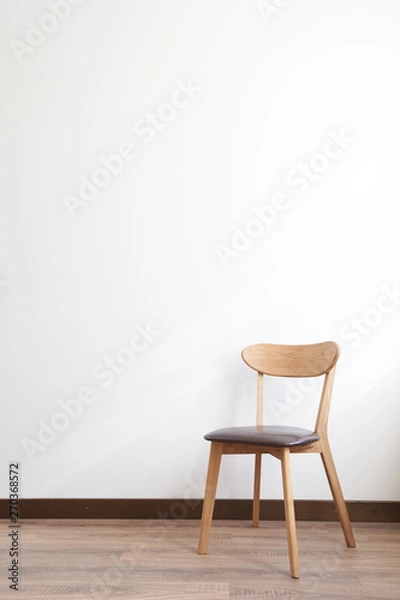 Fototapeta Wooden chair over white wall interior