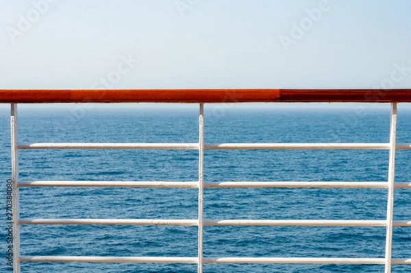 Fototapeta railing on the cruise with sea in background.