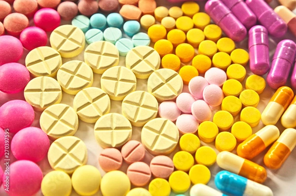 Fototapeta Kolorowe tabletki leku tekstury wzór tła w różnych rodzajach leków to kapsułka, tabletka w aptece, która jest stałą farmaceutyczną doustną postacią dawkowania leku do leczenia choroby u pacjenta