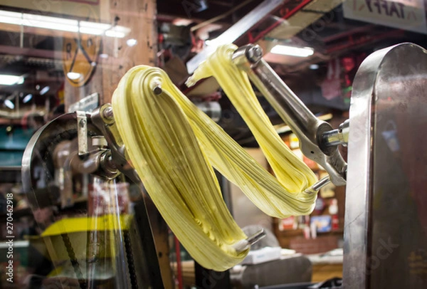 Obraz Taffy being stretched by machine