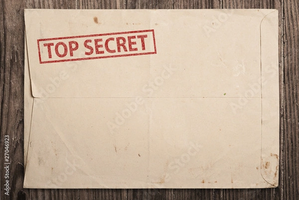 Obraz Open top secret envelope on table.