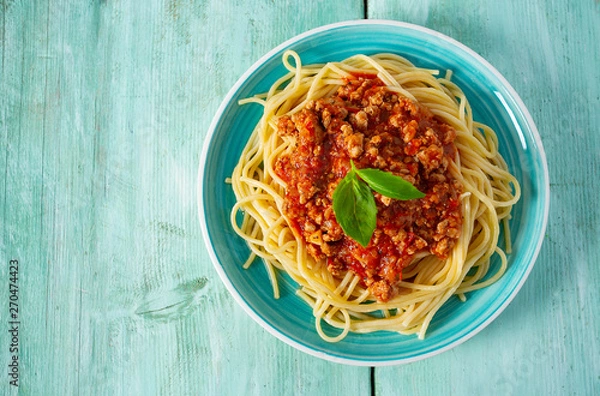 Obraz spaghetti bolognese on wooden surface