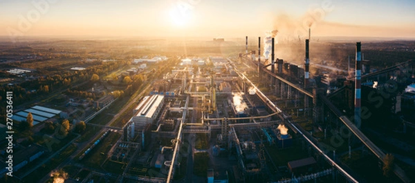 Fototapeta industrial landscape with heavy pollution produced by a large factory