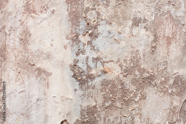 Fototapeta Old beige chipped wall with humidity stains texture background