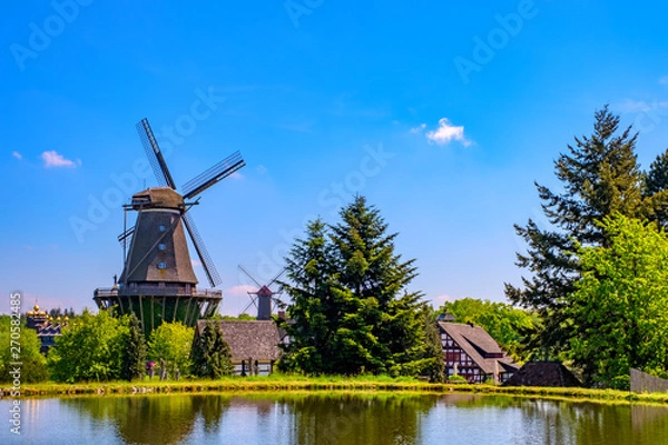 Obraz Colorful windmill in Gifhorn of the lake in summer