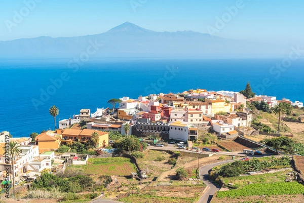 Fototapeta Agulo is a municipalities of the Canary Island of La Gomera. The well-preserved, original village of Agulo is the main town of the municipality. In the back, the Pico del Teide on Tenerife