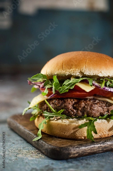 Obraz Tasty hamburger with vegetables and rucola