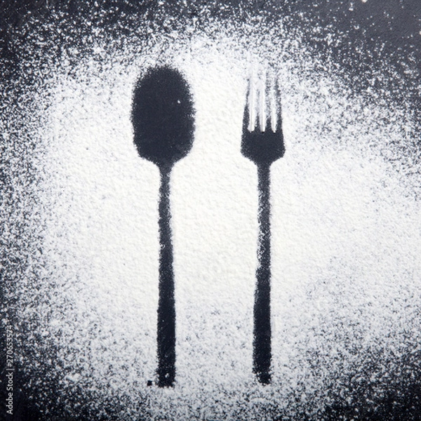 Fototapeta Spoon and fork silhouette made with flour on the dark texture background,