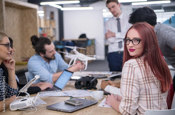 Fototapeta redhead business woman learning about drone technology