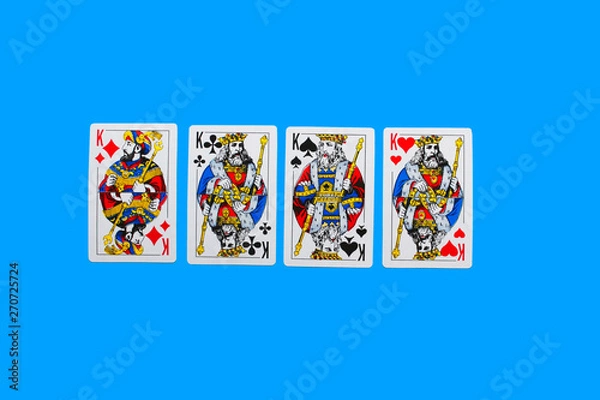Obraz Playing card. Hand with card playing poker .close up of male hand with playing cards and chips at home. Pocker game. Casino cards as background. Concept for games, gambling in casino and sports poker.