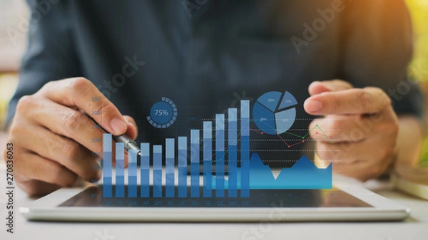Fototapeta Businessman investment consultant analyzing company financial report balance statement working with digital augmented reality graphics. Concept for business, economy and marketing. 3D illustration.