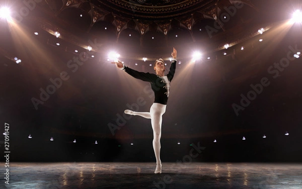 Fototapeta Ballet. Classical ballet performed by a couple of ballet dancers on the stage of the opera house.