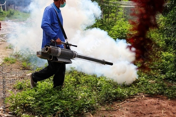 Fototapeta  Employees use fogging machines to get rid of mosquitoes to prevent dengue fever, take blurred images