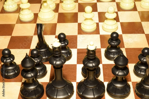 Obraz Chessboard under black pawns like a skill background