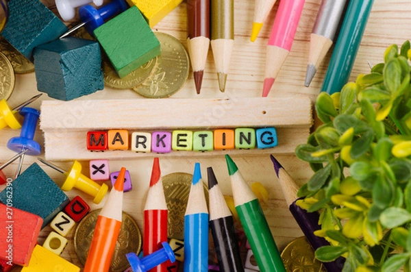 Obraz Business Campaign Concept background, colorful cube with word MARKETING on wooden desk