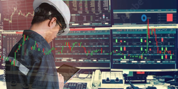 Fototapeta Double exposure of business man or engineer using tablet with stock trading room and stock trading chart background for investment business concept