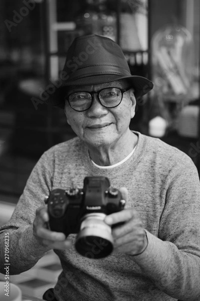 Obraz Portrait of Asian Senior Man drinking coffee in cafe