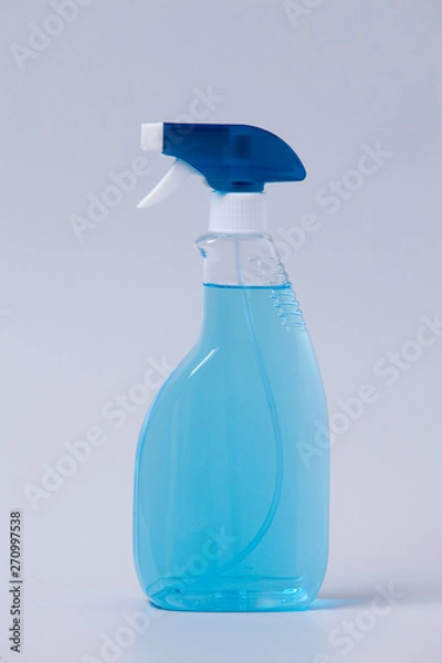 Fototapeta Window cleaner in plastic bottle with spray and fabric towel on gray (